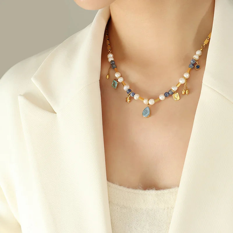 JINDOOR Elegant Golden Necklace with Freshwater Pearls, Blue Stones & Celestial Charms – Interwoven Jewelry for Women