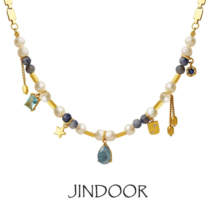 JINDOOR Elegant Golden Necklace with Freshwater Pearls, Blue Stones & Celestial Charms – Interwoven Jewelry for Women