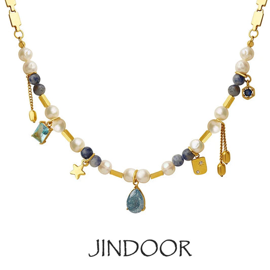 JINDOOR Elegant Golden Necklace with Freshwater Pearls, Blue Stones & Celestial Charms – Interwoven Jewelry for Women
