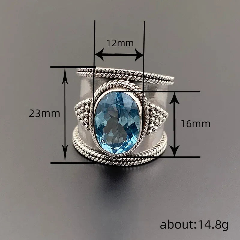 A woman's blue topaz gold-plated blue gemstone clawless and shiny ring