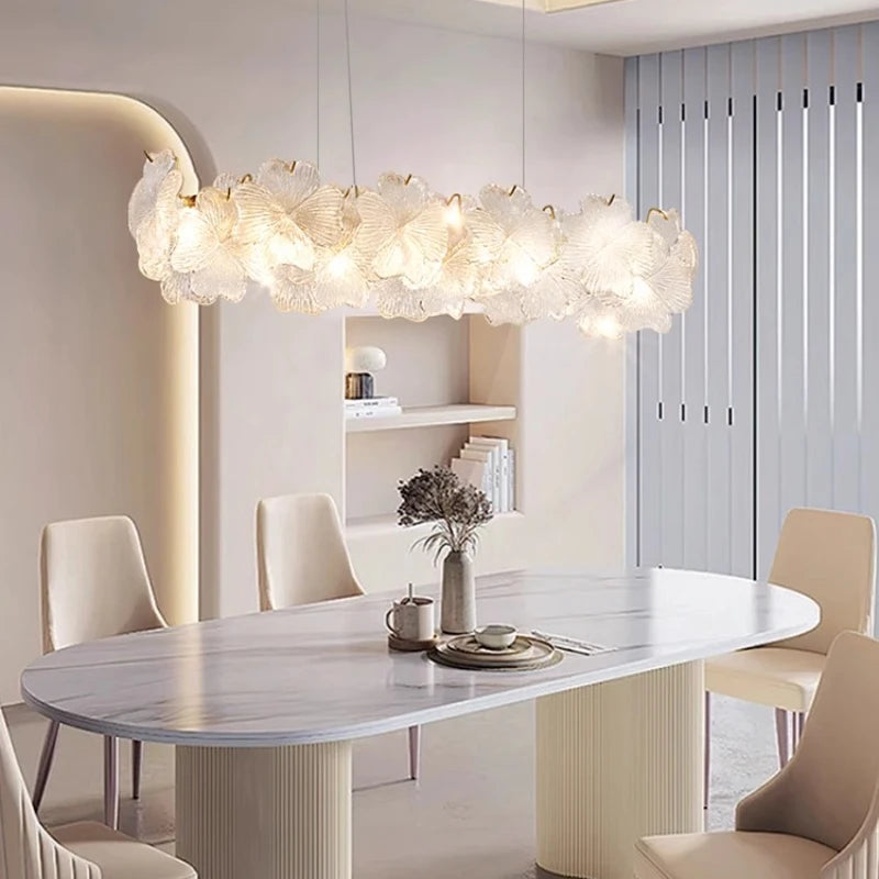 French-style minimalist restaurant - modern and simple long dining table with crystal chandelier